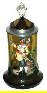 Blown Amber Glass 1/2L Stein. Enameled Landsknecht: Blown Glass 1/2L Stein with enameled Landsknecht. Prism lid and blue glass handle. Dark green body prunts