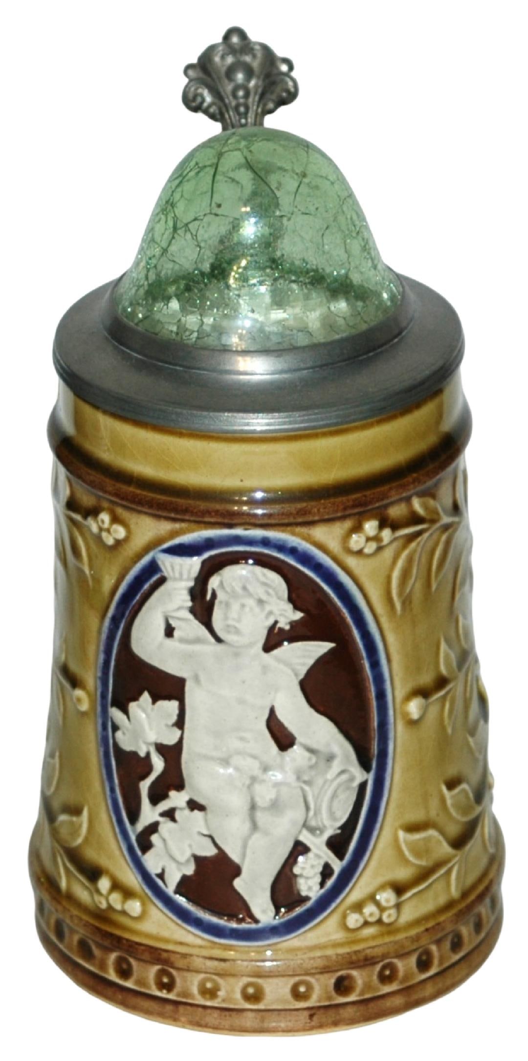 Majolica Hungarian Cherub Stein w Crackle Glass Ld: Majolica Relief 1/2L. Cherub holds goblet. Blown green crackle glass inlay lid. Hungarian. Mint.