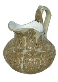 Mettlach Earlyware Relief Floral Creamer