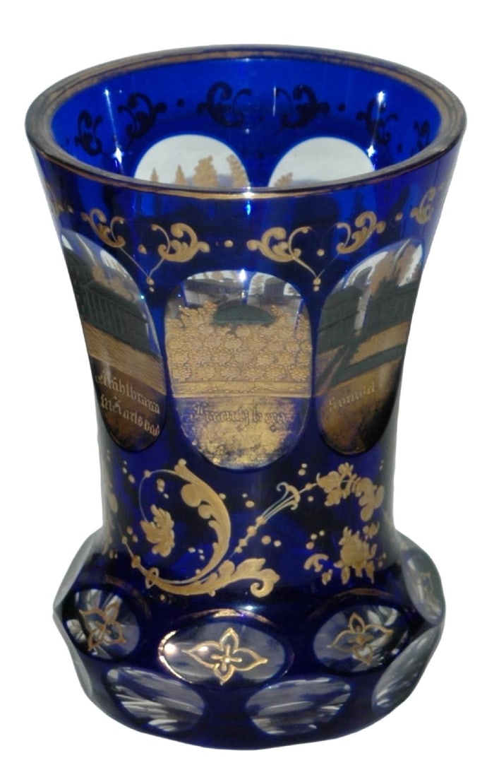 Cut Spa Views Bohemian 1860 Overlay Glass Beaker: Blown Overlay Glass 5” Beaker. Cobalt over clear. Seven wheel-cut oval panels of spa views with gold and silver. Bohemian circa 1860.