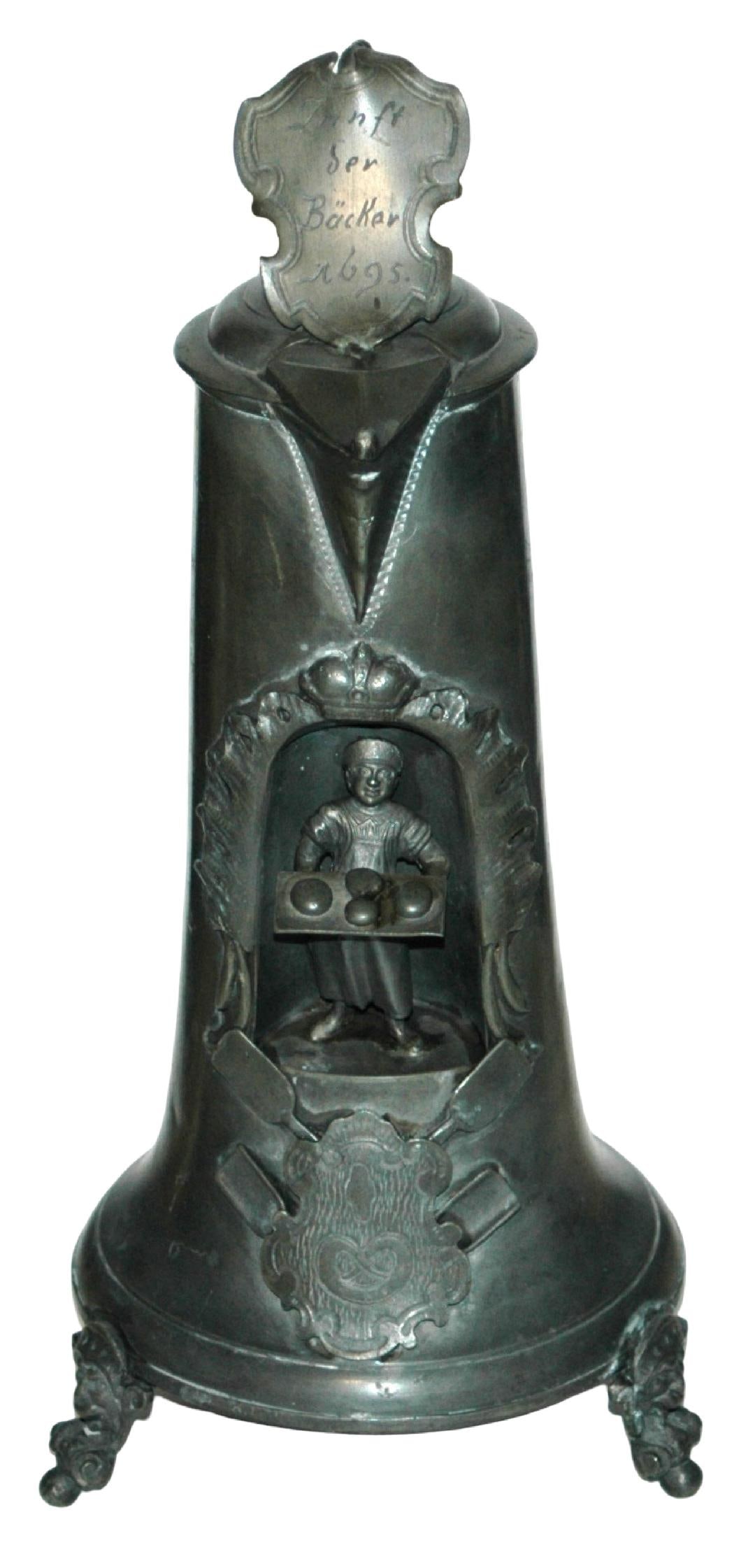 13-1/2" Pewter Occupational Baker Stein c.1870: Pewter Nich Krug 13 1/2” Occupational. Baker holds sheet of bread. Four feet. Circa 1870. Mint.
