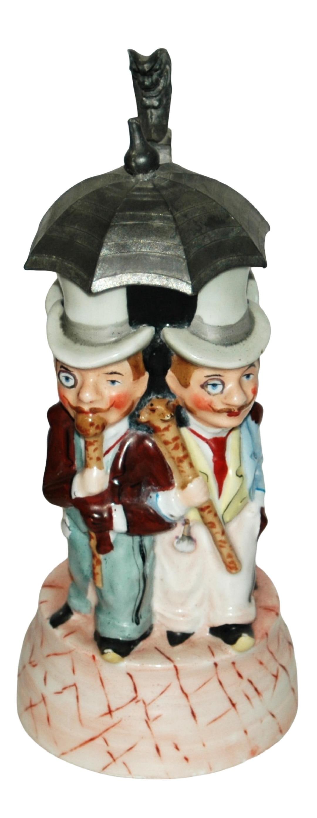 Men Under Umbrella Character Stein w Uncommon Base: Character Stein 1/2L Porcelain. Four men under umbrella. All wear top hats. Uncommon music box base.