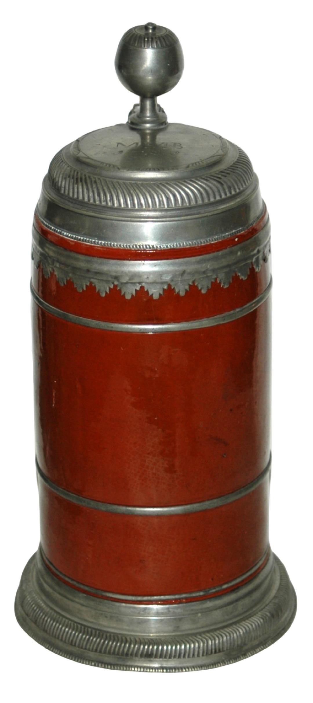 1-1/4L Saxon 1723 Stein w Great Pewter Mounts: Hafnerware Stein 1 1/4L Saxon Factory. Brick red glaze. Super pewter mounts, base rim and pewter lined handle. Lid dated 1723. Hinge skirts. Very good condition.