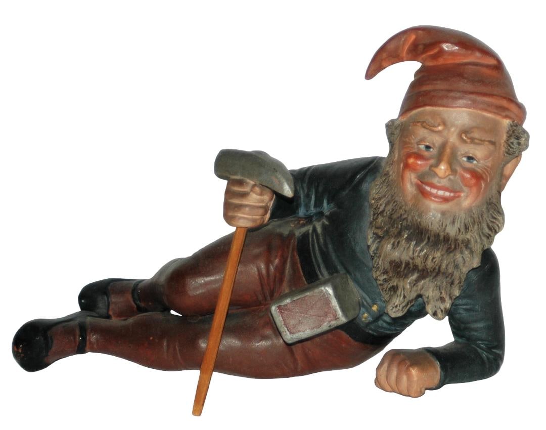 Terracotta Reclined Dwarf w Pick Axe Figure: Terracotta 7” by 5 ½” Figure. Reclining dwarf holds pick. Normal wear.