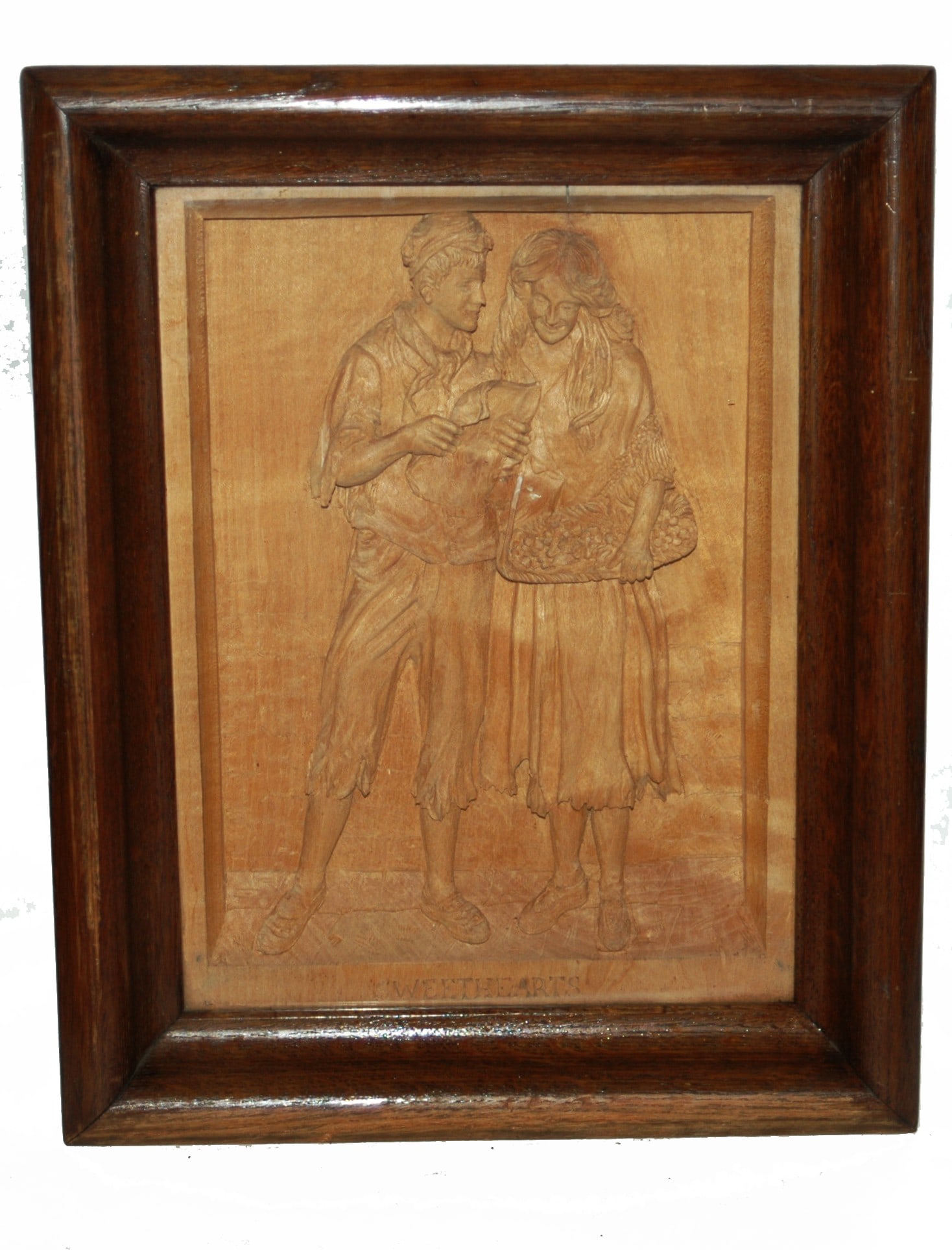 Black Forest Carved Wood Framed Plaque: Black Forest Carved Wood 17” by 13 1/2” Framed Plaque. Couple read letter while she holds basket of flowers.