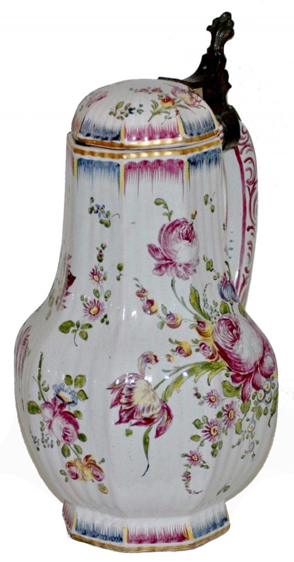 Floral 8-Sided Strassberg Faience 1-1/4L Stein: Faience 1-1/4L Strassberg French Factory. Delicately painted floral design on eight sided bulbous body. Circa 1850. Faience lid.
