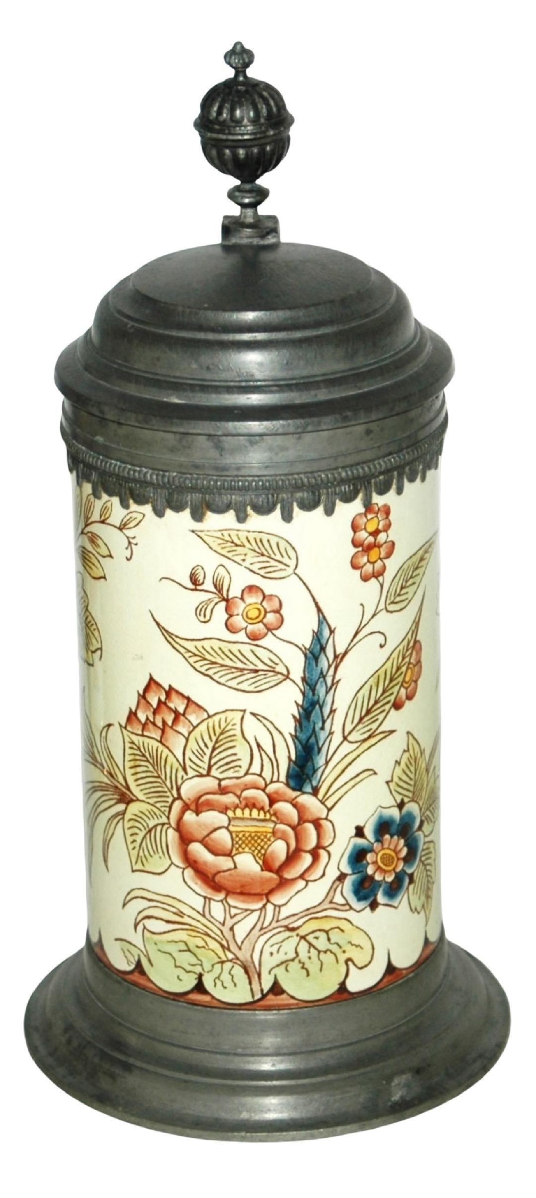 1L Mettlach Faience Floral Stein Pewter Base & Rim: Mettlach Faience #5024 PUG 1L. Floral design wraps around body. Pewter base, top rim and lid. Mint.