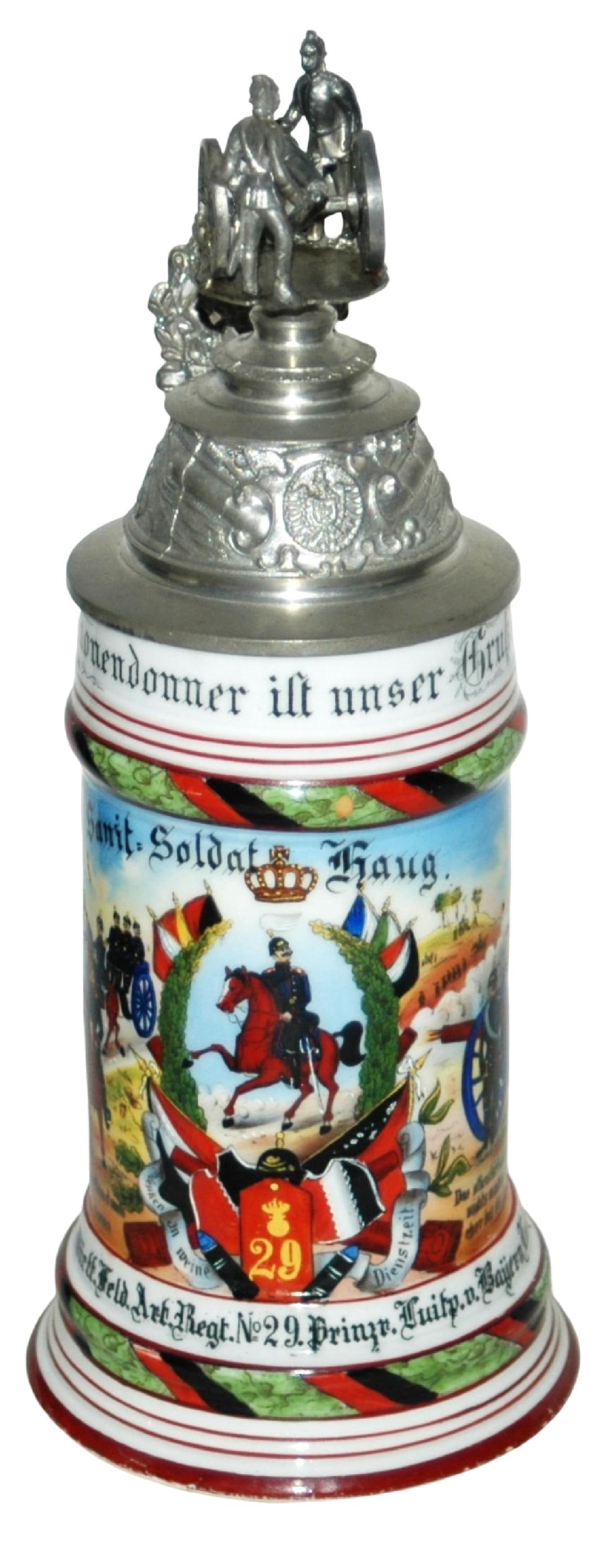 Regimental 6 Batt Feld Art No 29 Medic Stein: Regimental Stein 1/2L Porcelain. “ 6 Batt. 2 Wurtt. Feld Art. Regt. No 29 Prinz Luip. V, Bayern Ludwigsburg 1903-05, (Medic) Sanit. Soldat Haug.” Two side scenes. Rear roster. Crew top can