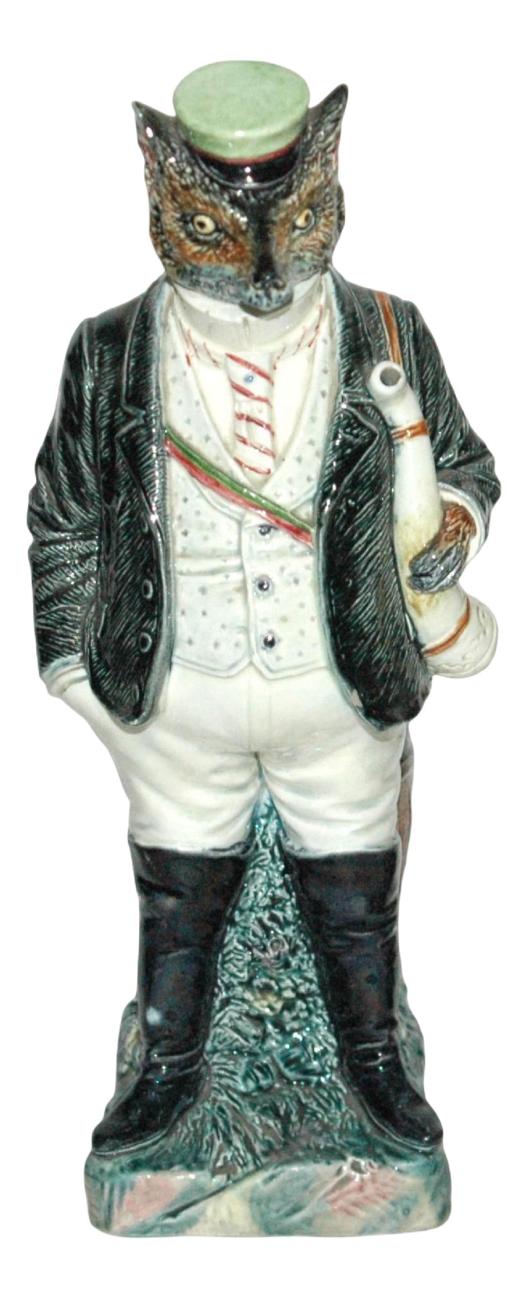 Uncommon Majolica Fraternal Student Fox Bottle: Majolica Character 12” Bottle. Fox dressed in fraternal student attire. Uncommon.