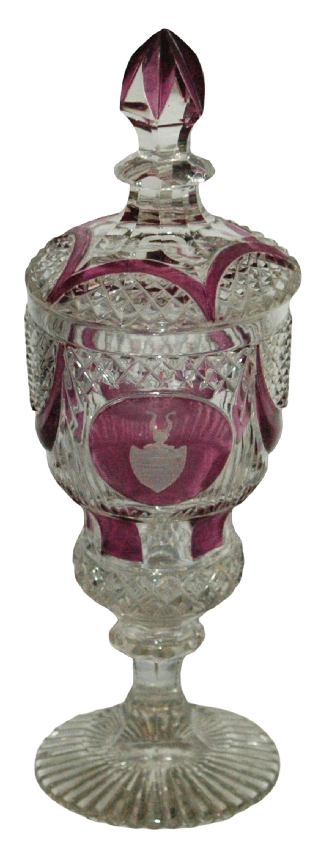 c1890 Pokal Wheel Cut Shield & Faceted Body: Blown Glass 9 ½” Pokal. Amethyst stained on faceted body. Wheel-cut shield. Bohemian circa 1850.