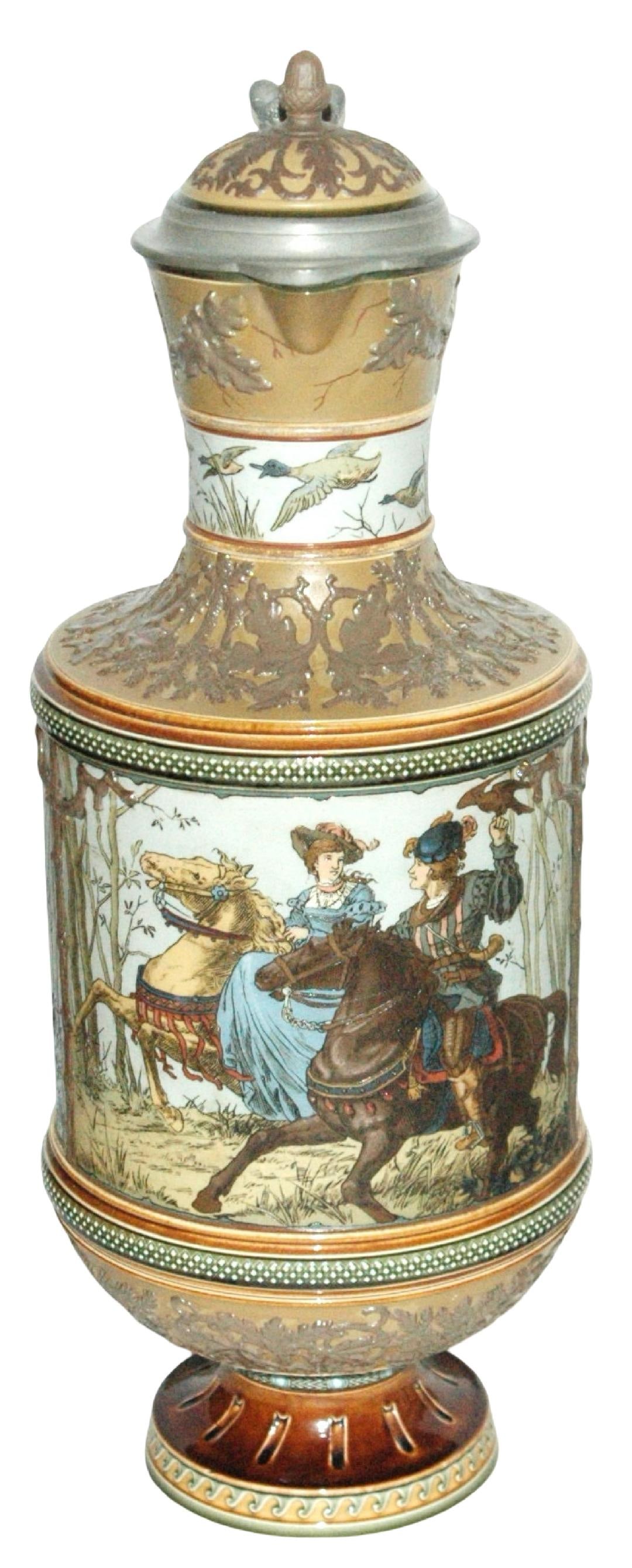 4-1/2L Mettlach Falconer Fox Hunt Stein 3D Acorn: Mettlach #1690 Etched 4 1/2L. Falconer and others in fox hunt. Inlay lid with acorn finial. Figural branch handle. Mint.