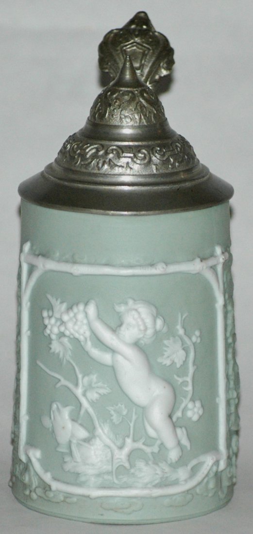 Jasperware Miniature Cherub w Grapes Stein: Jasperware Relief 1/4L. Cherub hold cluster of grapes. Base has the Triebner, Ens & Eckert factory mark. Mint.