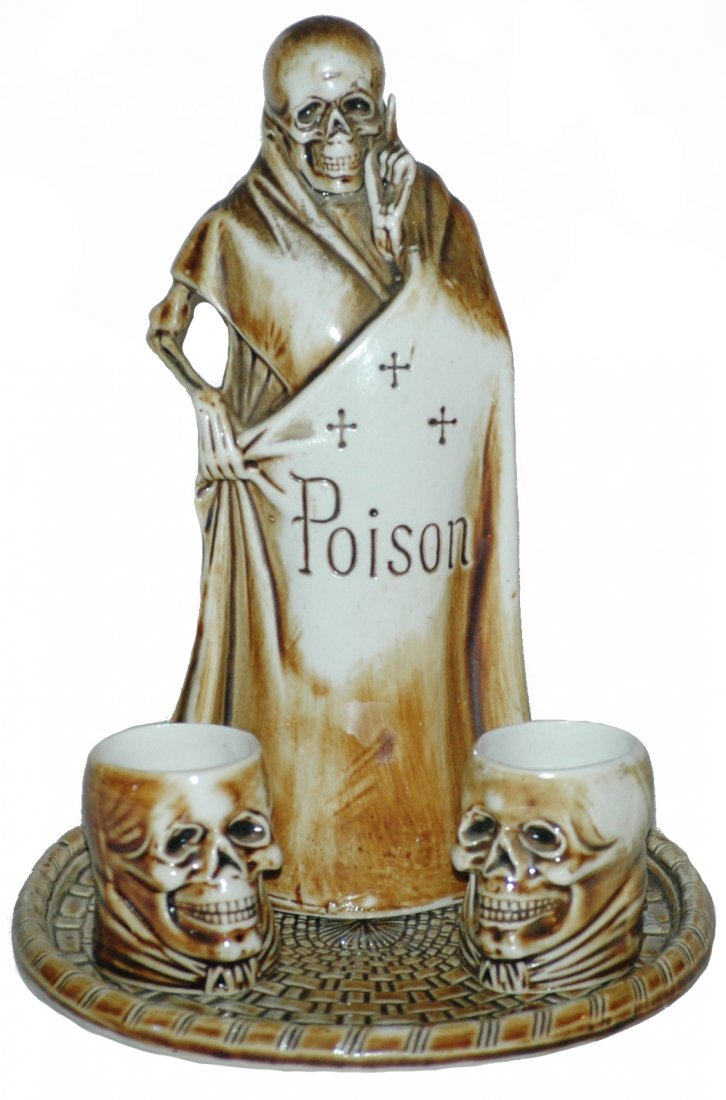 S & V Skeleton Decanter & Two Skull Shot Glasses: S & V 6-1/2" Skeleton Decanter. Tray with two skull shots. Mint.