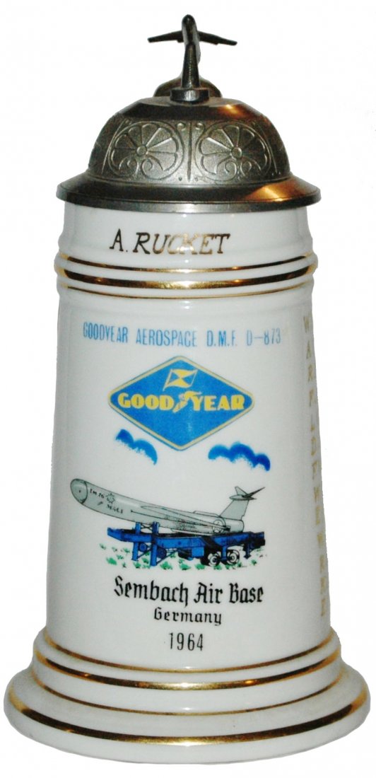 US Cold War w Mace Rocket Sembach Stein: American Cold War Regimental Stein 1/2L Porcelain. "Sembach Air Base, Germany 1964, A. Rucket." Goodyear mace rocket. Roster on sides. Mint.