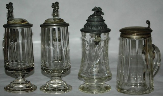 Lot of 4 Glass Steins Facet Body & Line Design: Group of Four Glass Steins. 1) Blown 1/4L with faceted body and prism lid. Dwarf thumblift. Mint. 2) Blown 1/4L with faceted body and prism lid. Dwarf thumblift. Mint. 3) Blown 1/4L with polished line