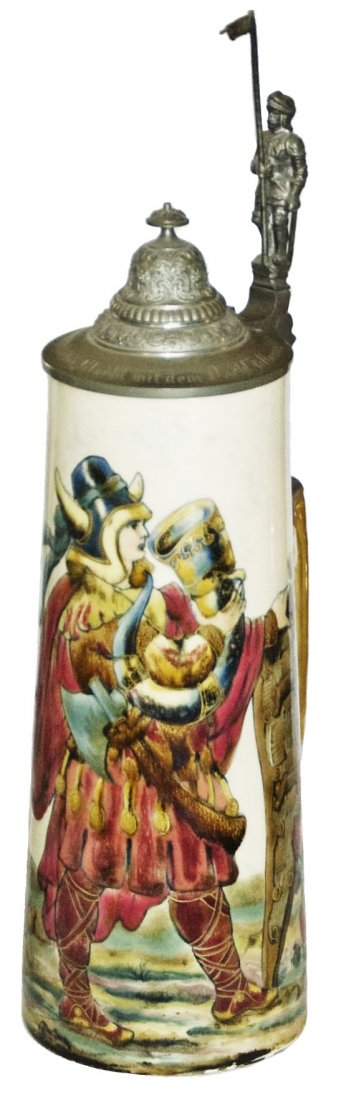 Majolica 2L Stein Woman in Warrior Clothing: Majolica Zsolnay PUG 2L. Woman in warrior clothing. Knight thumblift. 11 1/2" to body top rim14 " to tip of lid16 3/4" to tip of Knight thumbliftMint.