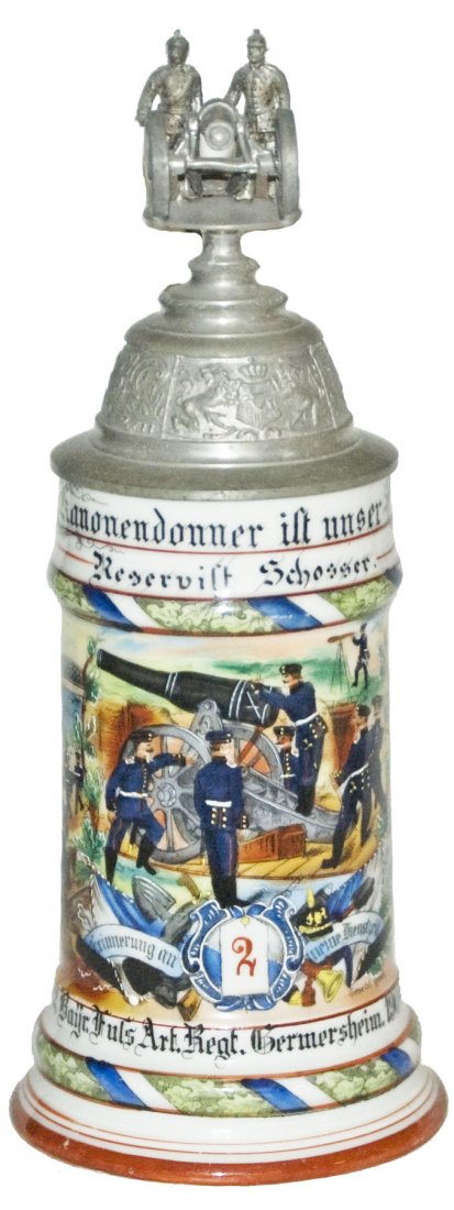 Fuss Art Regt Germersheim Regimental Stein: Regimental Stein 1/2L Porcelain. "6. Comp. 2. Bayr. Fuss. Art. Regt. Germersheim 1904-06, Reservist Schosser." Two side scenes. Rear roster. Crew top cannon finial. Mint.
