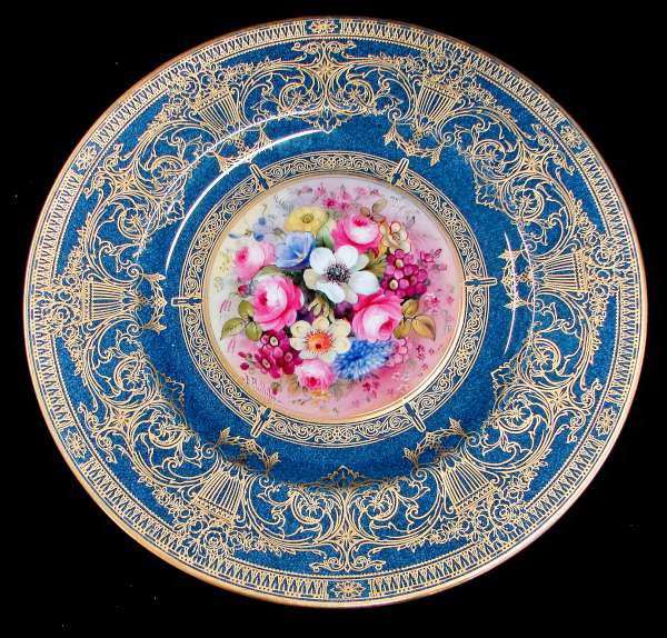 11 Handpainted Signed Royal Worcester Plates: Set of Eleven (11) Royal Worcester hand painted and signed plates with floral centers. Each plate is signed "E Phillips" and is a hand painted work of art. These were made for Ovingtons in New York an