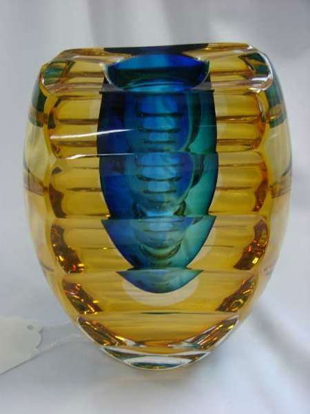 Signed Goran Warff Art Glass Vessel Kosta Boda Uni: Warff, Goran (Swedish, 20th Century) A blown and cut glass vessel measuring 7" height, 5 1/4" width and 4" depth, signed "Goran Warff" and numbered and signed "… 66 121 Kosta Boda Unique"