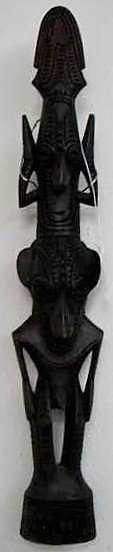 Oceanic Arrows and Wood Totem: 2 Oceanic Art items including: 1. Arrows with varied tips. 29 arrows left. Approx. 50" height. And 2. Wooden Totem with two men. 17 1/2" height by 3" width. From the Eugene and Inez Gilbert Collection