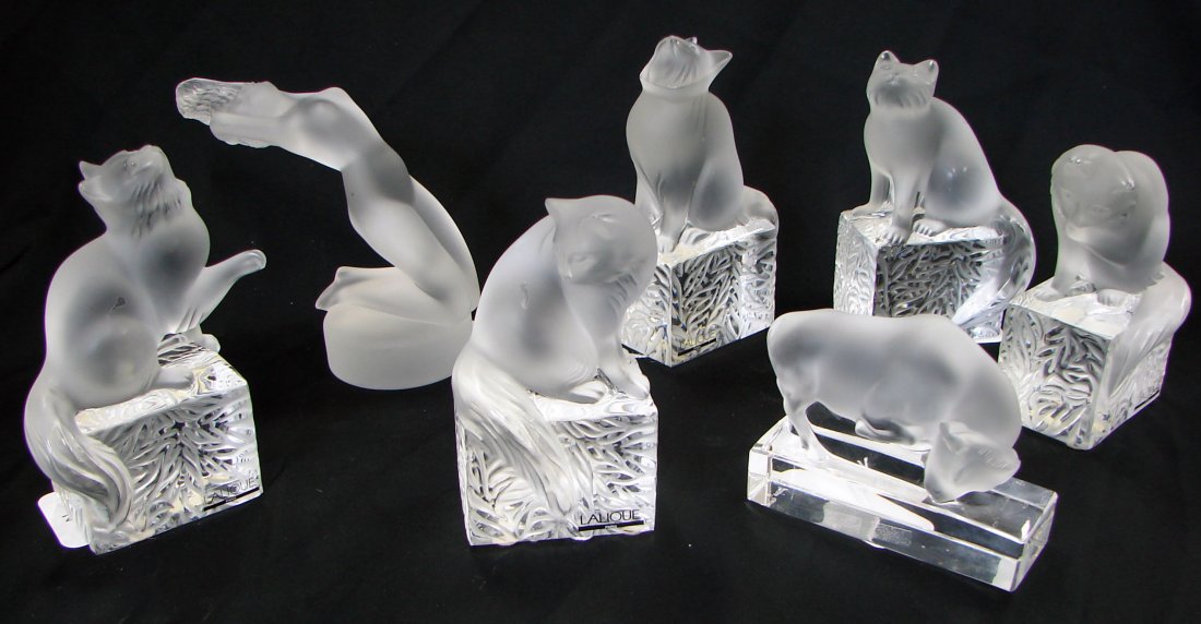 7 Lalique Sculptures Cats: Lot of seven (7) Lalique (Paris) Decorative Glass sculptures including: five (5) Lalique sculptures of cats in different positions. Approximately 6" height by 3 1/2" width; one (1) Lalique sculpture o