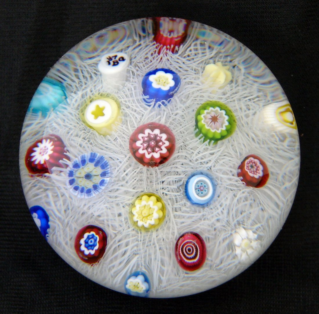 Baccarat 1974 LE Paperweight Millefiori: Baccarat paperweight with date cane indicating "B 1974" within the pattern. Also dated and numbered on the back "170 1974" Description: Scattered Millefiori with a colorful array of 20 complex canes o