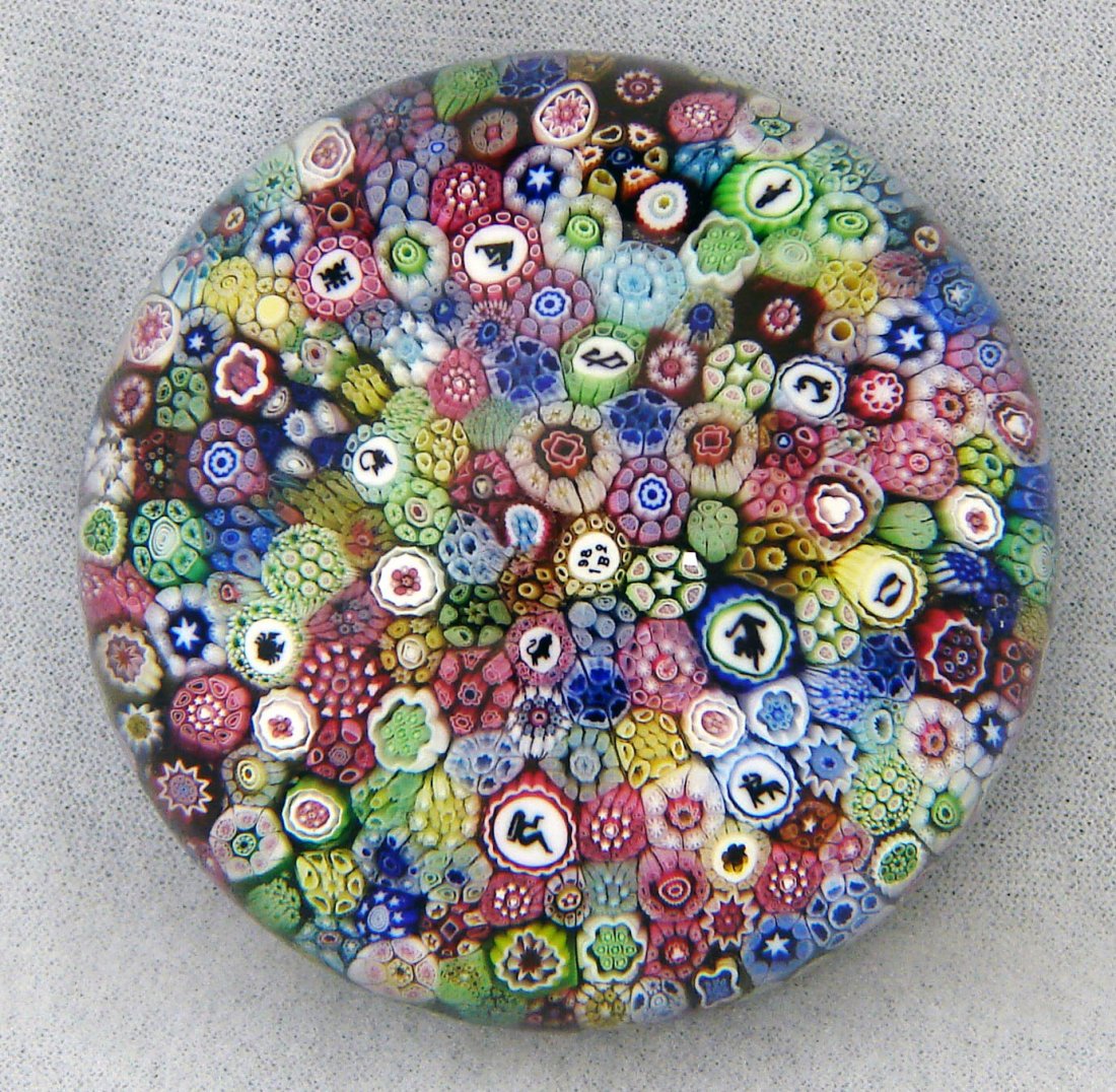 1982 LE Baccarat Millefiori Zodiac Paperweight: 1982 Baccarat paperweight with a "B1982" date cane, limited edition number 44 of 300. Description: Close pack millefiori weight with an assortment of complex canes interspersed with silhouette canes d