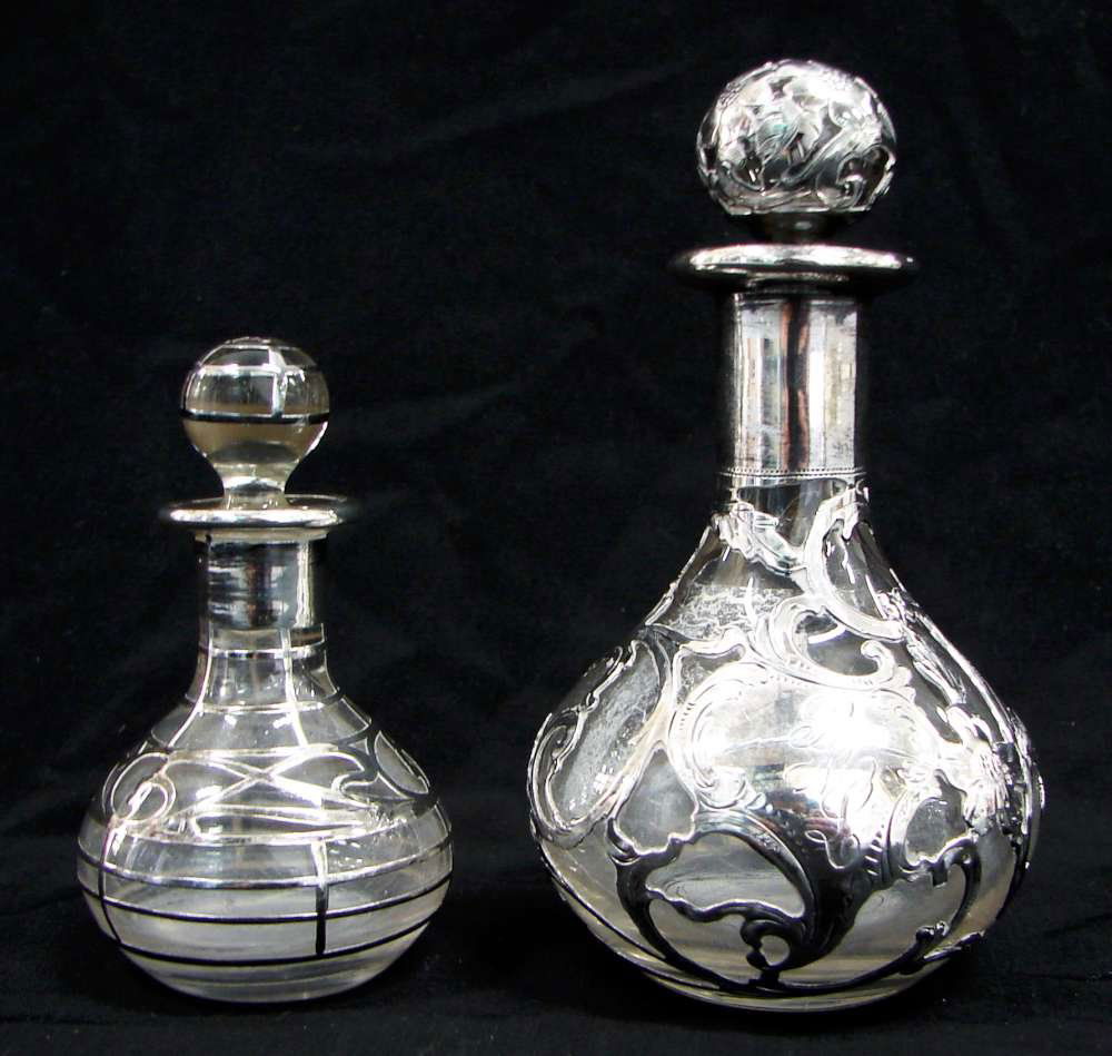 Two Sterling Overlay Perfume Bottles 999/1000 Alvin: Lot of two (2) glass perfume bottles including: 1. A perfume bottle with a sterling silver overlay. "999/1000 Fine Alvin 19 Patented"; "316" etched into bottom of glass stopper; "178" etched into bott