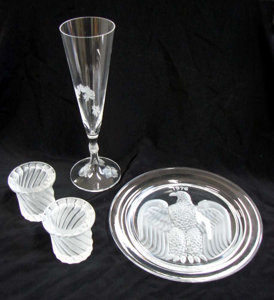 Four Lalique Crystal Items: Lot of four (4) Lalique crystal including: one (1) Eagle Plate from 1976. Signed "Lalique France". Excellent condition; two (2) crystal Lalique toothpick holders. Signed "Lalique France". Excellent co