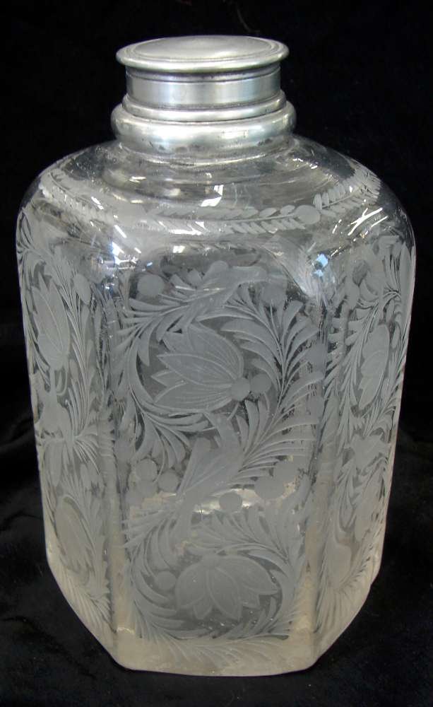 Apothecary Jar Pewter Lid Mouth Blown Hand Engraved: Six sided apothecary jar with engraved flower and bird motif; c. 1750 with a pewter screw on cap and interior lid. Interior lid seems to be stuck in the mouth. Rough, snapped pontil. Stiegel type. 6 3