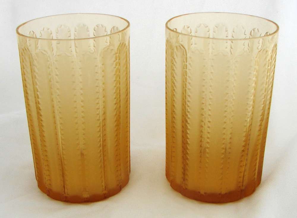 Seven Rene Lalique Jaffa Amber Tumblers Signed: Seven (7) Rene Lalique "Jaffa" pattern tumblers,each 4 7/8" in height and 3 1/8" in diameter, all marked "R. LALIQUE" upon the bottom. Five are in perfect condition, two have very tiny chips at the ri