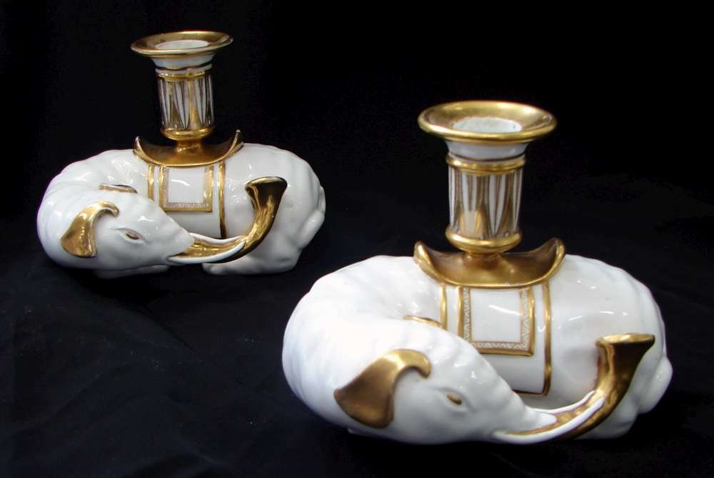Pair Circa 1800 English Spode Bone China Chinese El: Rare pair of Spode bone china elephant form candlesticks marked with the red hand written "Spode" marks in use circa 1800. One has a reglued cup. Minor wear to the gilt highlights, overall a nice pair
