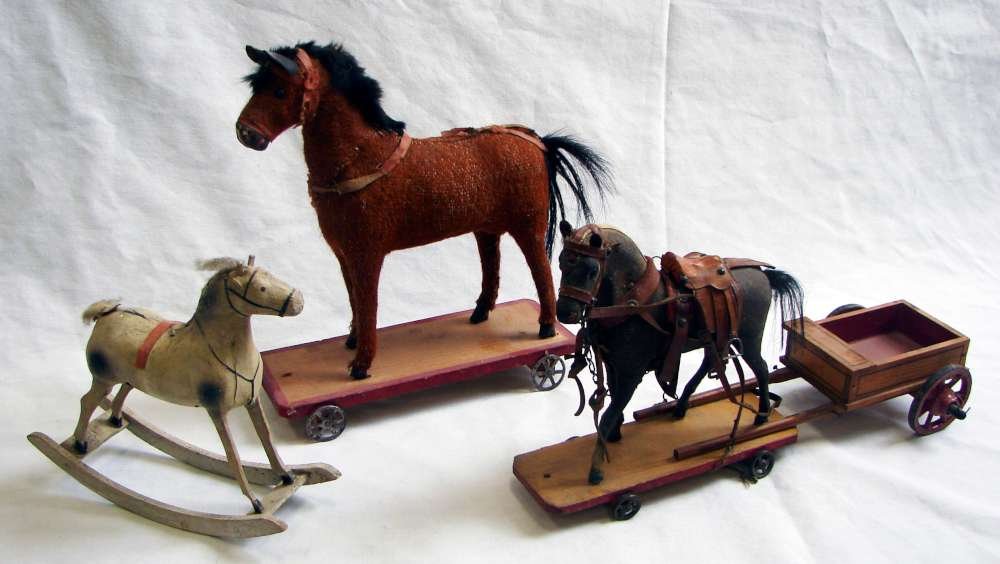 3 Toys Circa 1890 2 Horse Pull Toys 1 Rocking: Three late 19th / early 20th century horse themed toys including: 1. a paper maché rocking horse; 2. a very nicely painted paper maché pull-toy horse with an elaborate leather bridle and saddle set