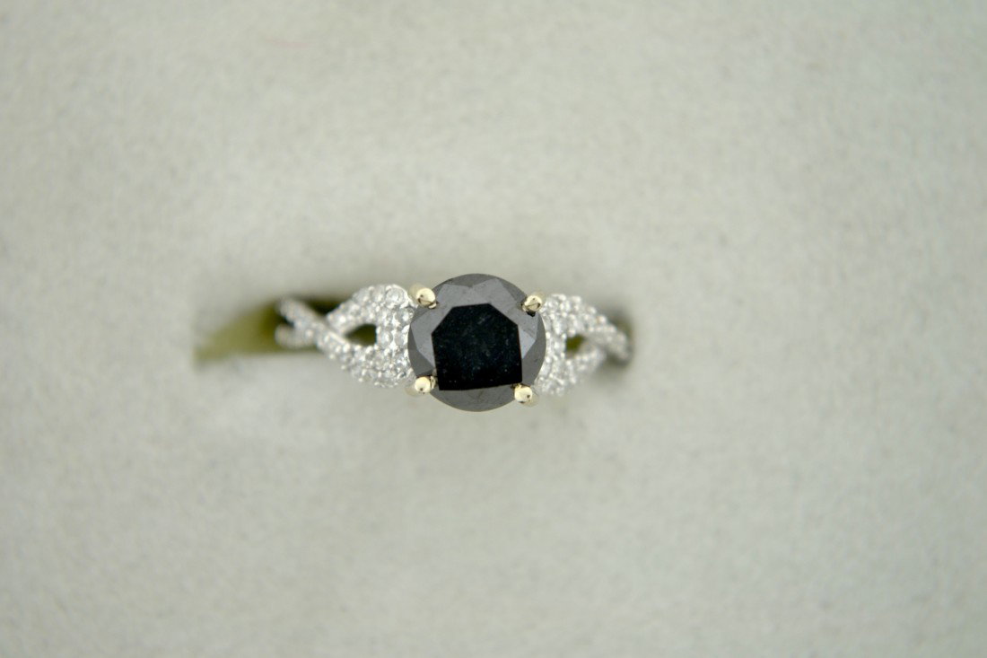 Black and White Diamond Ring Appraised Value: $7,781: 18k white gold diamond ring with a 1.72 ct black diamond surrounded by 0.20 ct of white diamonds