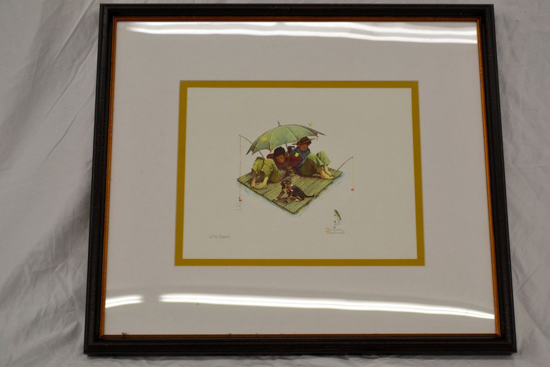 Norman Rockwell's Fisherman's Paradise: Framed offset lithograph of fisherman's paradise by Norman Rockwell numbered 694/2000