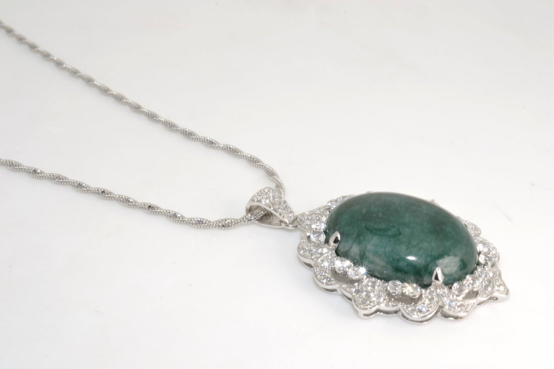 Emerald & Sapphire Necklace Appraised Value: $7,602: Solid platinum plated over silver necklace with 31.69 ct of enhanced emerald(beryl) and sapphires K38J1