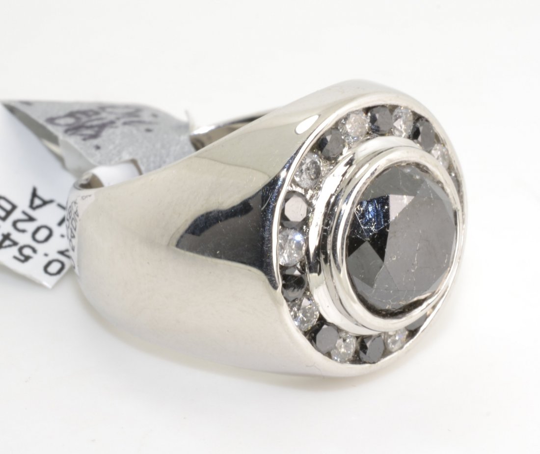 Black & White Diamond Ring Appraised Value: $9,678: Solid silver ring with 0.5 ct of diamonds and 7.02 ct of black diamonds K19E95
