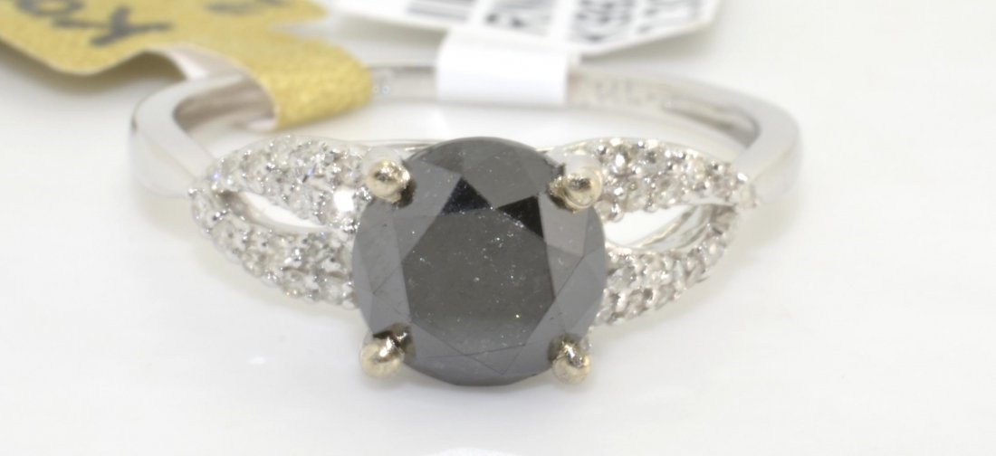 Black & White Diamond Ring Appraised Value: $4,245: 18K white gold mounted with a 1.68 ct black diamond center stone and 0.15 ct of adjacent white diamonds K99J6