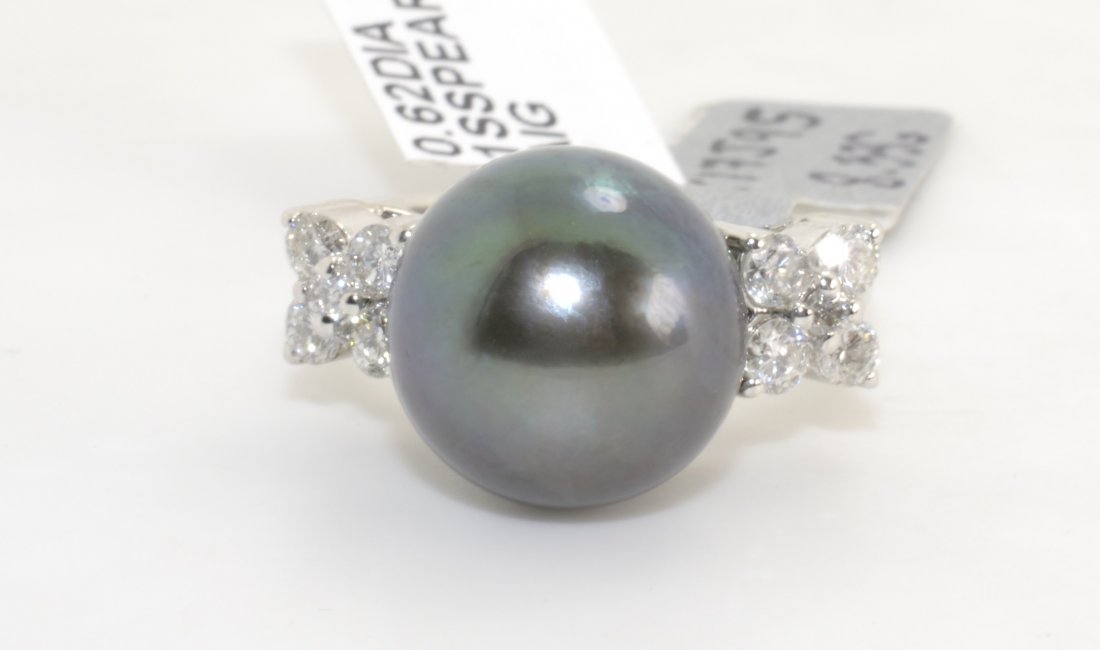Tahitian Cultured Pearl & Diamond Ring AV: $6,785: 14K white gold ladies cast ring with a tahitian pearl center and 0.62 ct of diamonds K17J95