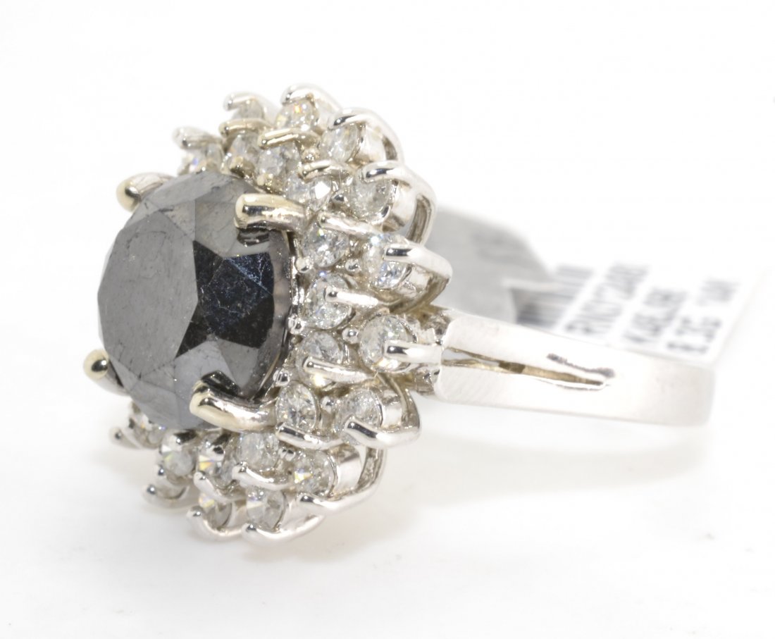 Black & White Diamond Ring Appraised Value: $10,450: 14K white gold ring with 7.77 ct of black and white diamonds K46J96