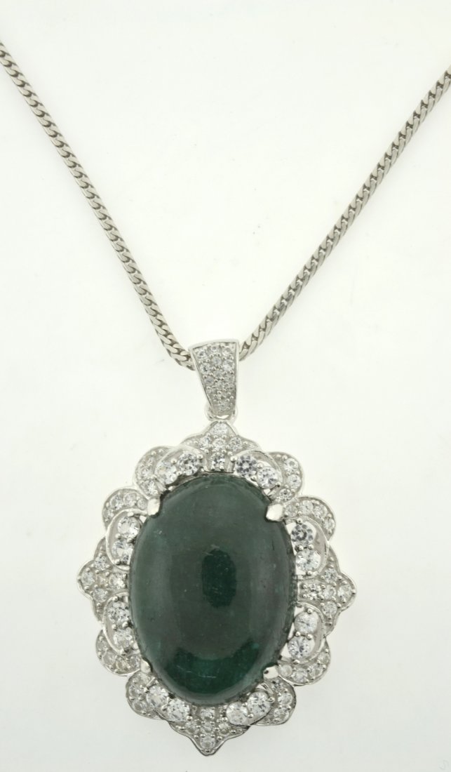 Emerald & Sapphire Necklace Appraised Value: $9,298: Solid platinum plated over silver necklace with 31.03 ct enhanced emerald/beryl (CENTER STONE) and 2.52 ct of colorless sapphires K44J2