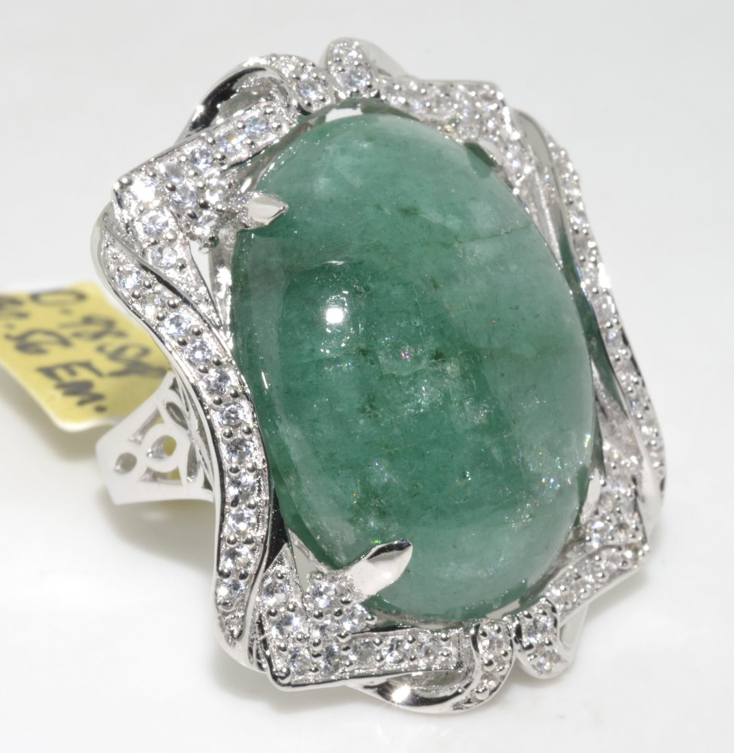 Emerald & Sapphire Ring Appraised Value: $9,518: Solid platinum plated over silver ring with 30.56 ct enhanced emerald/beryl (CENTER STONE) and 0.98 ct of colorless sapphires K38J2