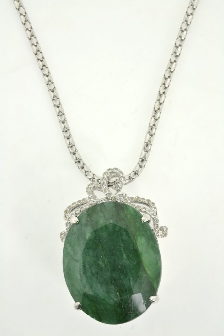 Emerald & Sapphire Necklace Appraised Value: $13,534: Solid platinum plated over silver necklace with 56.77 ct emerald/beryl (CENTER STONE) and 0.64 ct of colorless sapphires K37J9