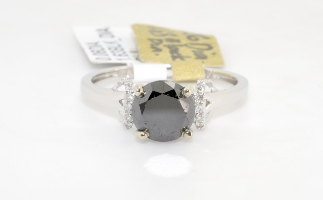 Black & White Diamond Ring AV: $4,007: 18K white gold ring with a 1.63 ct black diamond center stone and 0.06 cts of white diamonds SI1-SI2, G-H K99J5