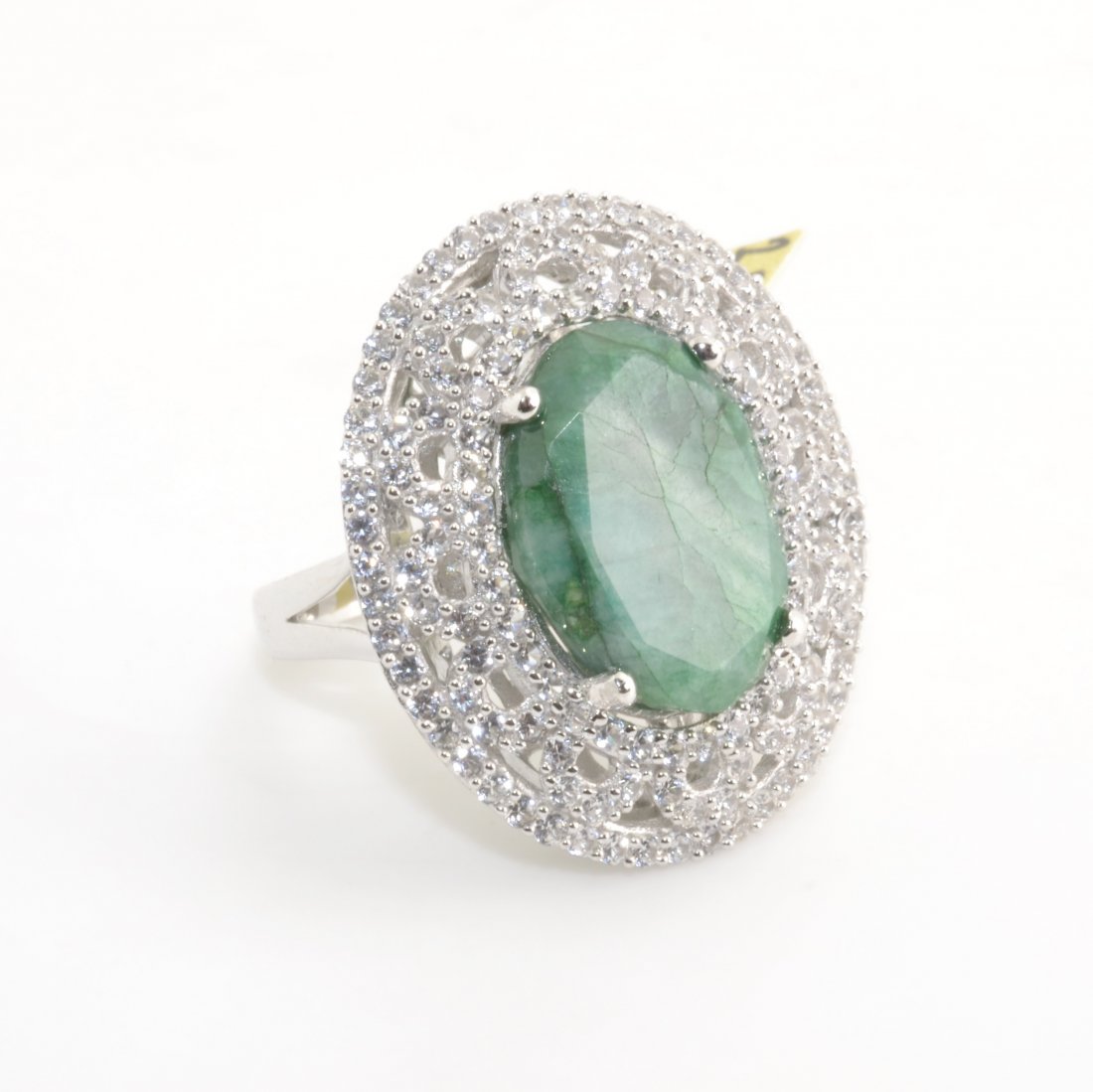 Enhanced Emerald & Sapphire Ring AV: $10,302: Solid platinum plated over silver ring with a 11.63 ct emerald beryl center stone and 2.58 cts of sapphire K44J1