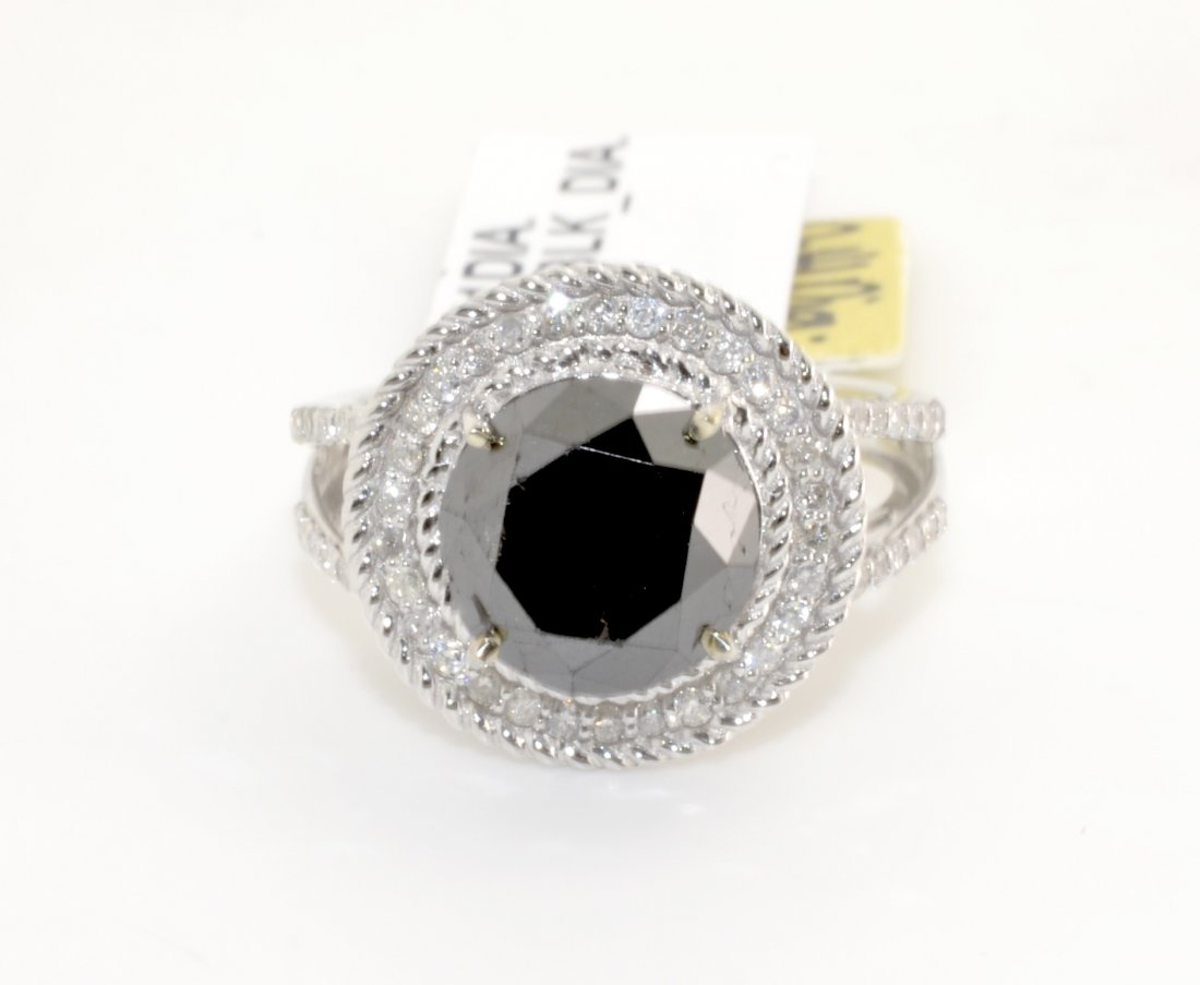 Black & White Diamond Ring AV: $8,450: 14K white gold ladies cast and assembled ring with 4.49 CARATS OF DIAMONDS **4.57 cts BLACK DIAMOND CENTER STONE** and 0.41 cts of prong and bead set WHITE DIAMONDS K26J18