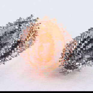 12.17ct Morganite and 1.07ctw Diamond 14K Rose Gold Ring: Fourteen karat (14K) rose gold natural morganite beryl and diamond ring. An oval brilliant cut natural morganite beryl gemstone is mounted in the center of the ring. Round brilliant and baguette cut d
