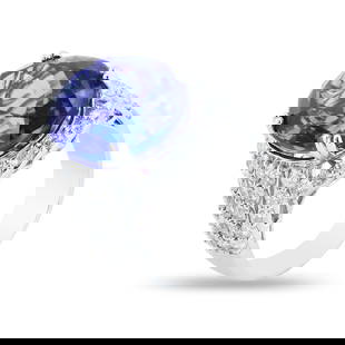 18.60ct Tanzanite and 2.38ctw Diamond Platinum Ring (GIA CERTIFIED): Platinum (PLAT) natural tanzanite zoisite and diamond ring. An oval modified brilliant cut natural tanzanite zoisite gemstone is mounted in the center of the ring. Round brilliant cut diamonds accent