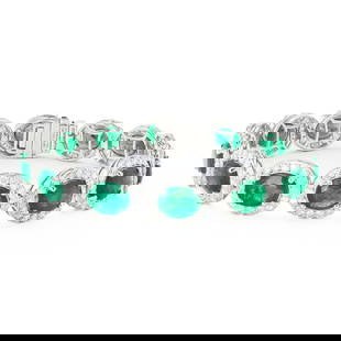 17.67ctw Emerald and 6.09ctw Diamond Platinum Bracelet: One polished. stamped. and tested platinum bracelet marked Oscar Friedman. The bracelet is mounted with: 14 genuine oval shaped emeralds weighing approximately 17.67 carats, and 208 genuine round diam