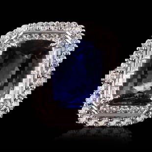 6.58ct Tanzanite and 2.24ctw Diamond 18K White Gold Ring (GIA CERTIFIED): One electronically tested 18KT white gold ladies cast and assembled tanzanite and diamond ring. Condition is new, good workmanship. The featured tanzanite is set within tiered diamond bezels supported